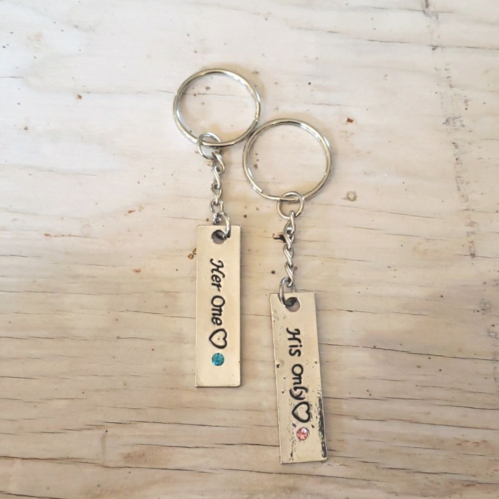 Key rings, his and hers, silvertone